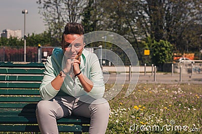 Portrait of a short hair girl sitting on bench Stock Photo