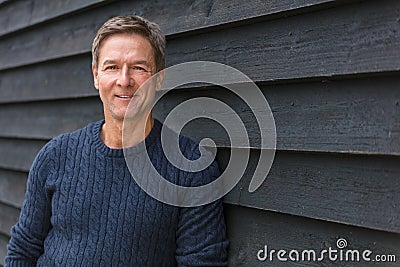 Happy Middle Aged Man Smiling Outside Stock Photo