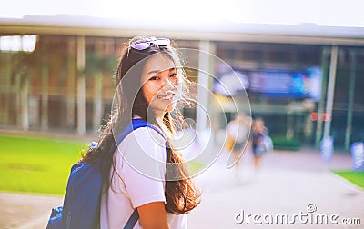 Portrait shot of young Asian female student smiling outdoor Stock Photo