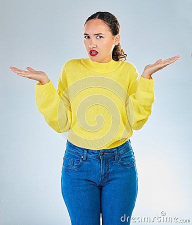 Portrait, shrug and woman confused, question and decisions against a white studio background. Female person, girl and Stock Photo
