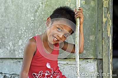 Portrait of shy laughing Filipino boy Editorial Stock Photo