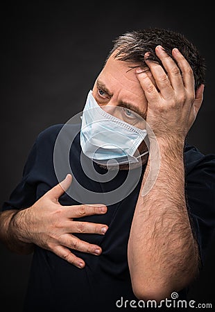 Sick old man in medical mask Stock Photo