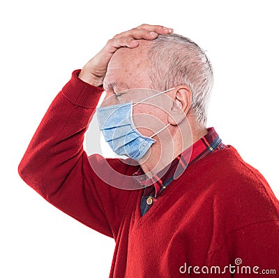 Portrait of sick old man in medical mask posing in studio Stock Photo