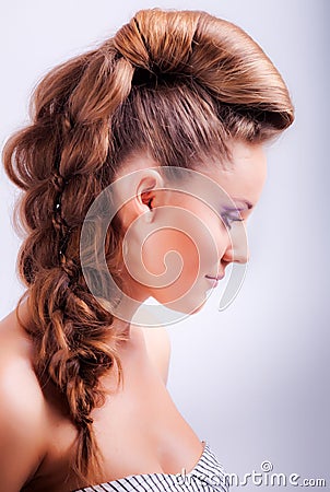 portrait sideview of blonde girl in elegant whimsical coiffure Stock Photo