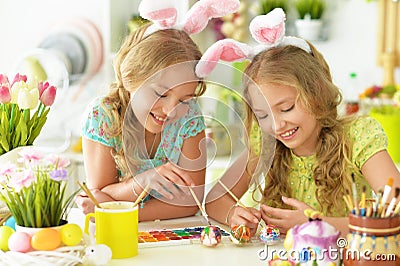 Portrait of sisters preparing for Easter in the kitchen Stock Photo