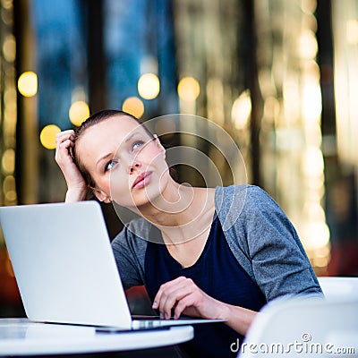 Portrait of a sleek young woman, using laptop computer Stock Photo