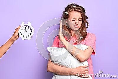 Sleepy girl with irritated face expression, feels tired after learning all night Stock Photo