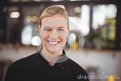 Portrait of smiling attractive waitress Stock Photo