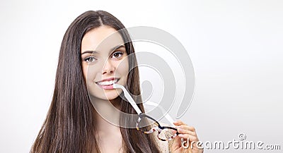 Portrait of smiling beautiful woman with spectacles in hand isol Stock Photo