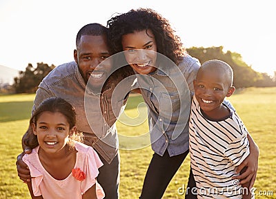 Portrait of smiling black family looking to camera outdoors Stock Photo