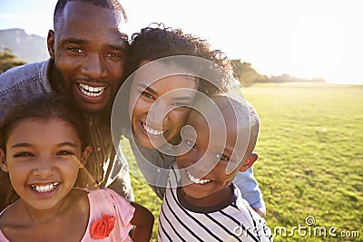 Portrait of a smiling black family outdoors, close up Stock Photo