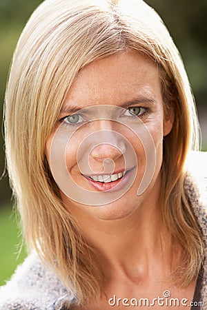 Portrait Of Smiling Blonde Woman Outdoors Stock Photo
