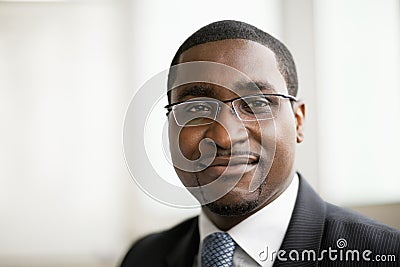 Portrait of smiling businessman in glasses, head and shoulders Stock Photo