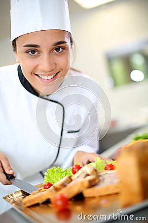 Portrait of smiling caterer girl Stock Photo