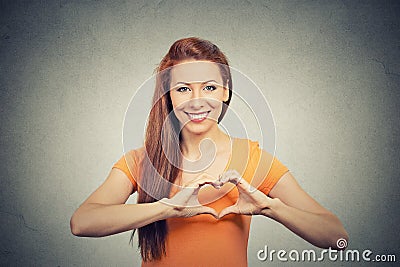Portrait smiling cheerful happy woman making heart sign with hands Stock Photo
