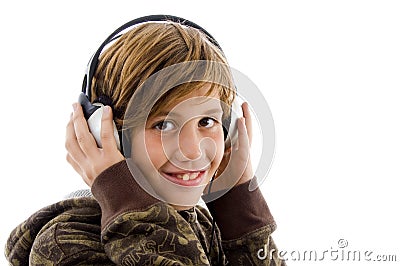 Portrait of smiling child enjoying music Stock Photo