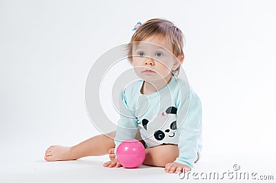 Portrait of a smiling child with a toy ball, isolated on a white background Stock Photo