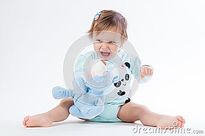 Portrait of a smiling child with a toy bear, isolated on a white background Stock Photo