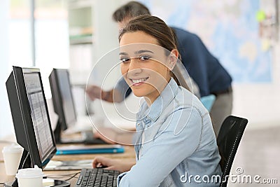 Portrait of smiling college girl working Stock Photo