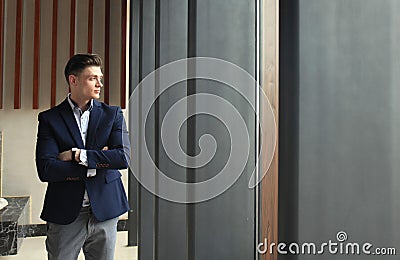 Portrait of smiling confident businessman in suit. Stock Photo