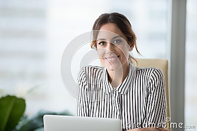 Portrait of smiling confident female boss looking at camera Stock Photo