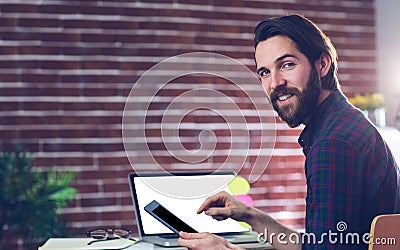 Portrait of smiling creative businessman using digital tablet Stock Photo