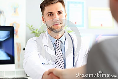 Doctor shaking hand Stock Photo