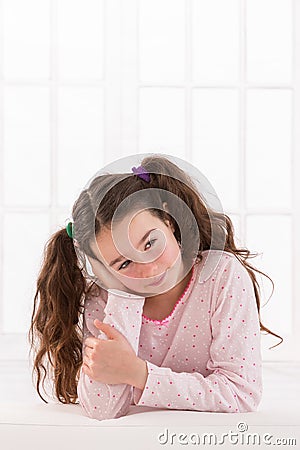 Portrait of smiling girl she wears quilts with Stock Photo