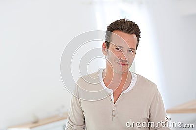 Portrait of smiling handsome man at home Stock Photo