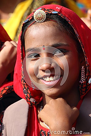 Portrait of smiling Indian girl at Pushkar camel fair Editorial Stock Photo