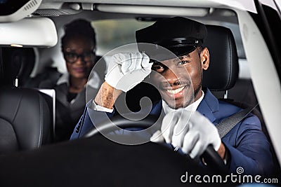 Portrait Of A Smiling Male Chauffeur Driving Car Stock Photo