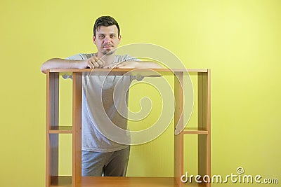 Portrait of smiling man master repairman with collected table looking at camera. Stock Photo