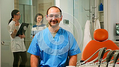 Portrait of smiling man nurse in dental office Stock Photo