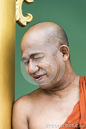 Portrait of smiling monk in Shwedagon Pagoda Editorial Stock Photo