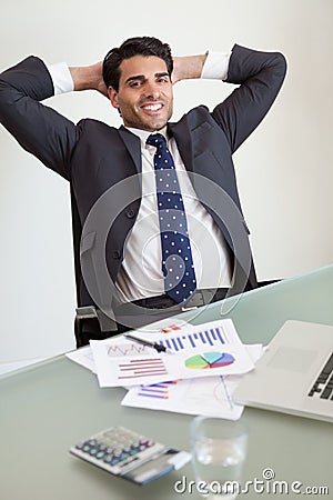 Portrait of a smiling sales person relaxing Stock Photo