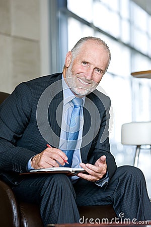 Portrait of smiling Senior business man Stock Photo
