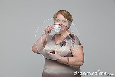 Portrait of smiling senior woman drinking tea Stock Photo