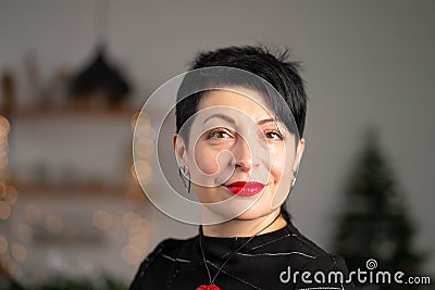 Portrait of smiling short haircut brunette woman. With tired eyes Stock Photo