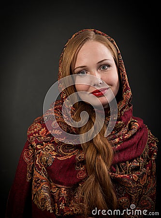 Portrait of smiling slavonic girl with red braided hair Stock Photo