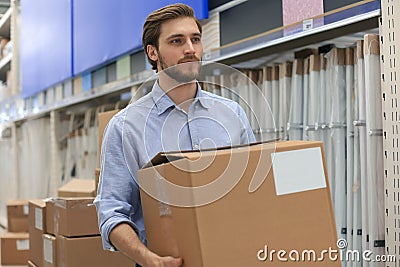 Portrait of a smiling warehouse keeper at work Stock Photo