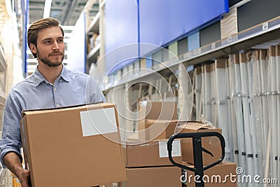 Portrait of a smiling warehouse keeper at work Stock Photo