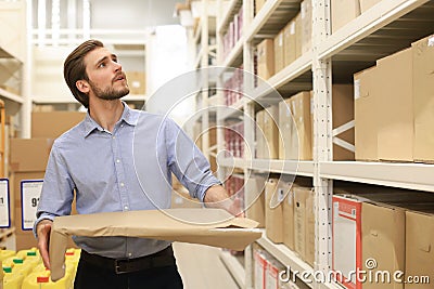 Portrait of a smiling warehouse keeper at work Stock Photo