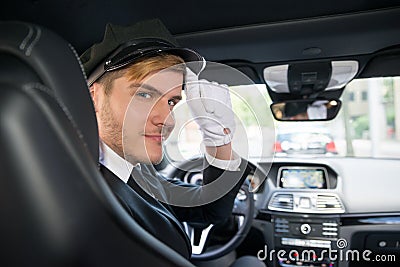 Portrait Of Smiling Young Chauffeur In Car Stock Photo