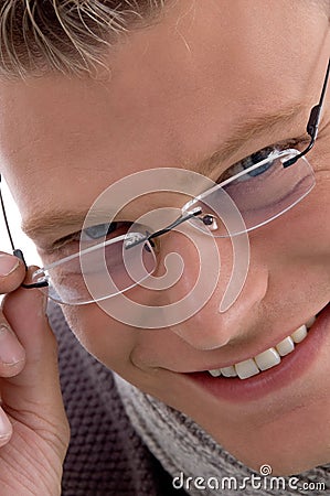 Portrait of smiling young male wearing eyewear Stock Photo