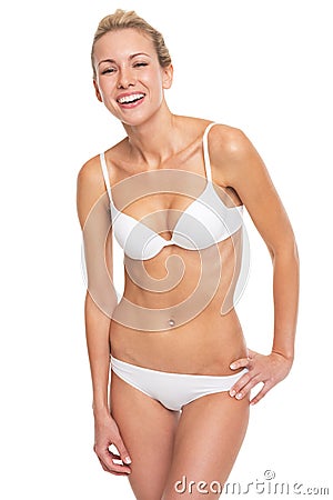 Portrait of smiling young woman in lingerie Stock Photo