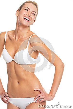 Portrait of smiling young woman in lingerie Stock Photo