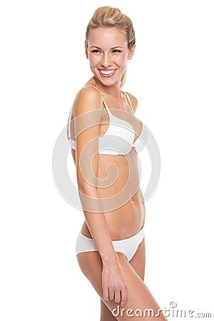 Portrait of smiling young woman in lingerie Stock Photo