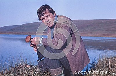 Portrait of soviet gold-prospector mushrooming in tundra Stock Photo