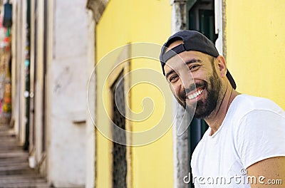 Portrait of a spanish man with snapback hat looking camera Stock Photo