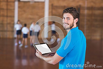 Portrait of sports teacher using digital tablet Stock Photo